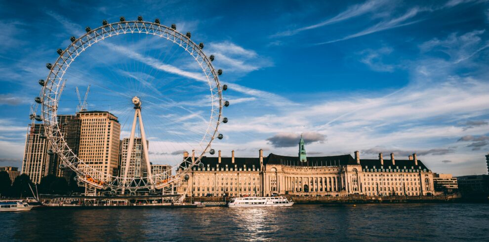 Stunning London cityscape featuring the London Eye ferris wheel by the River Thames.