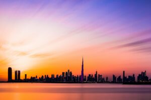 Beautiful view of the Dubai skyline featuring Burj Khalifa during a colorful sunset.